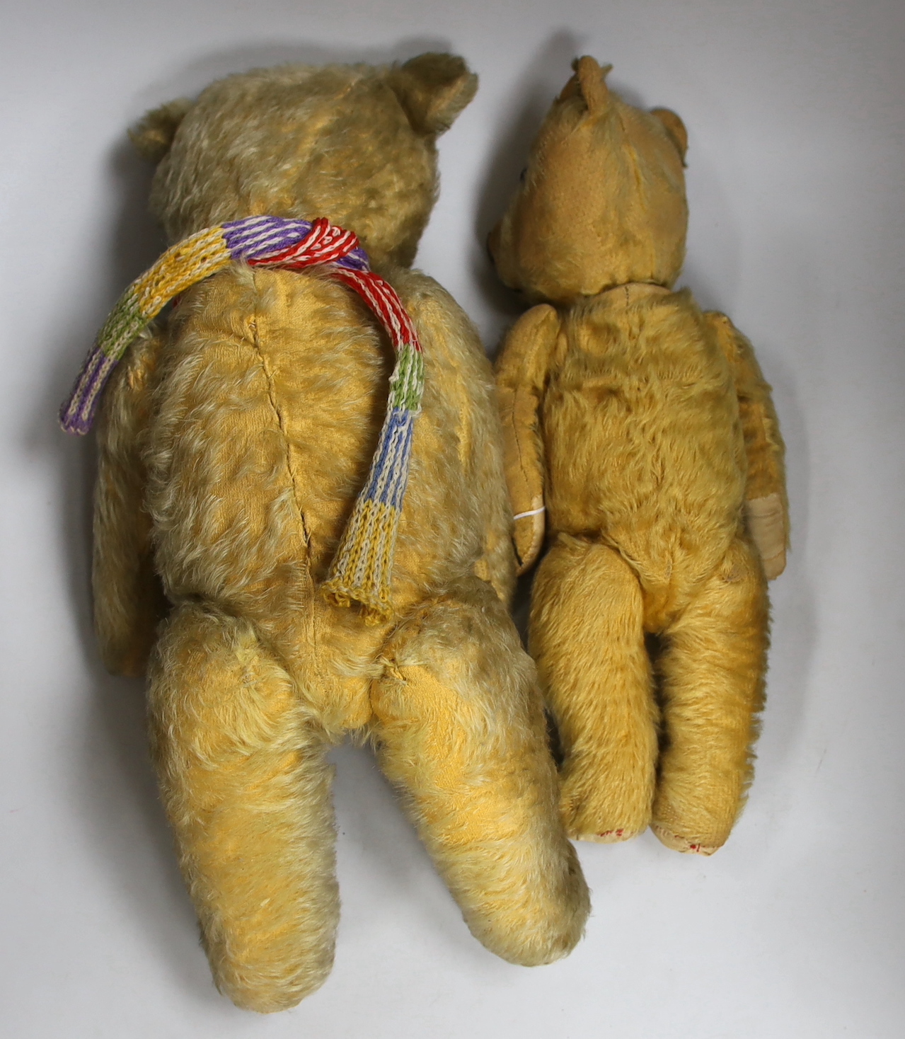 Two vintage English teddy bears with articulated limbs, the largest 50cm in high